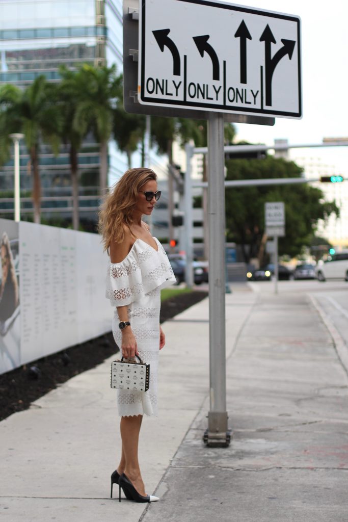 MIAMI; FLORIDA - JANUARY : German model and fashion blogger Alexandra Lapp (@alexandralapp_) wearing a MCM Berlin crossbody bag in black and white, Isla off the shoulder dress in white, Saint Laurent pumps, an IWC watch and cat eye sunglasses by Prada on January, 2017 in Miami *** Local Caption *** Alexandra Lapp