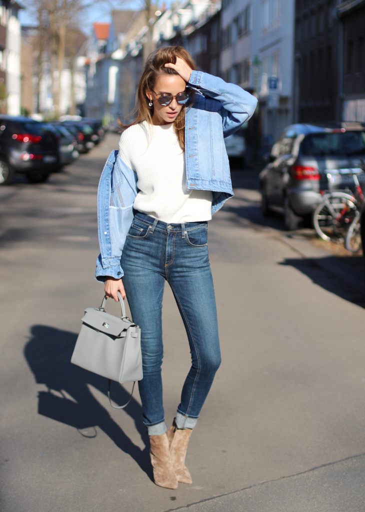 DÜSSELDORF, GERMANY - FEBRUARY 14: German fashion blogger and model Alexandra Lapp is wearing double denim - a light blue denim jacket by SET, slim fit high waist denim from Rag and Bone, off white knitwear from Oui, Hermes Kelly bag in light grey, Le Specs sunglasses, beige velvet booties from Gianvito Rossi and a light beige wool coat from Steffen Schraut on February 14, 2017 Düsseldorf, Germany. *** Local Caption *** Alexandra Lapp