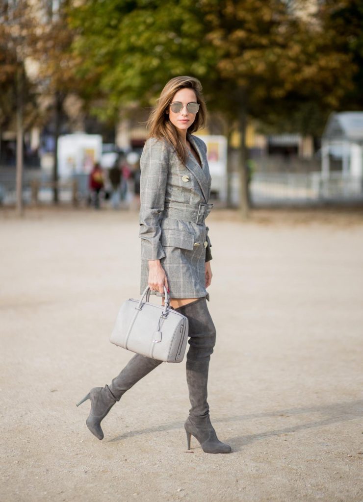 Alexandra Lapp wearing plaid blazer dress with a waist belt from Zara, the Essential Boston Bag with Monogramm in grey by MCM, silver mirrored sunglasses from le Specs, grey suede overknee boots by Gianvito Rossi is seen during Paris Fashion Week Spring/Summer 2018 on September 28, 2017 in Paris, France.