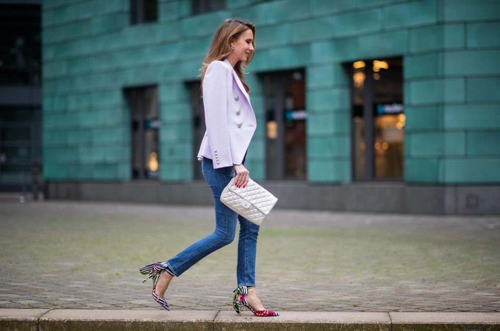 Alexandra Lapp in a Balenciaga Blazer look, wearing a pastel lilac double breasted blazer from Balenciaga, a pastel t-shirt with a logo print from Balmain, high rise skinny jeans Olivia from Citizens of Humanity, a vintage silver flap bag by Chanel and the Toubinana 80 Satin Cinestripes Multicolored Pumps from Christian Louboutin on May 01, 2019 in Duesseldorf, Germany. (Photo by Christian Vierig/Getty Images)